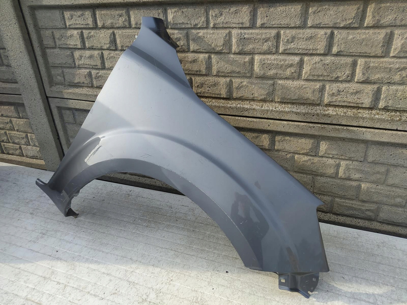 NISSAN NAVARA IV 16-22 BŁOTNIK PRZEDNI PRAWY - (12654338159)