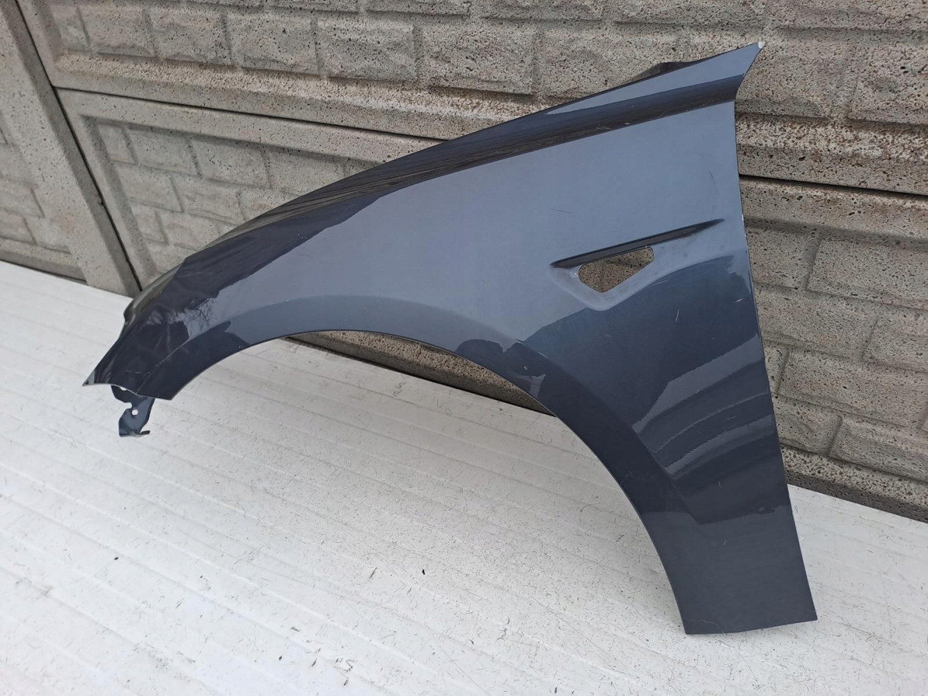 TESLA 3 III 2017-2022 BŁOTNIK PRZEDNI LEWY - (12958263995)