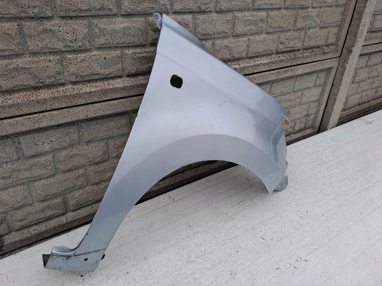 DAIHATSU MATERIA BŁOTNIK PRAWY PRZEDNI - (13012629371)